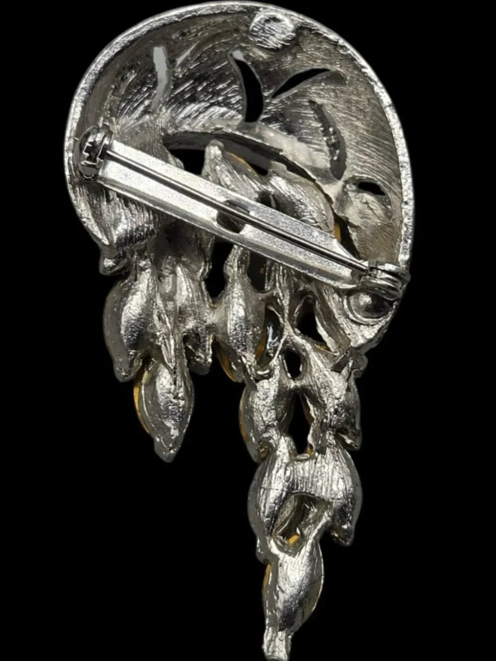 None this brooch